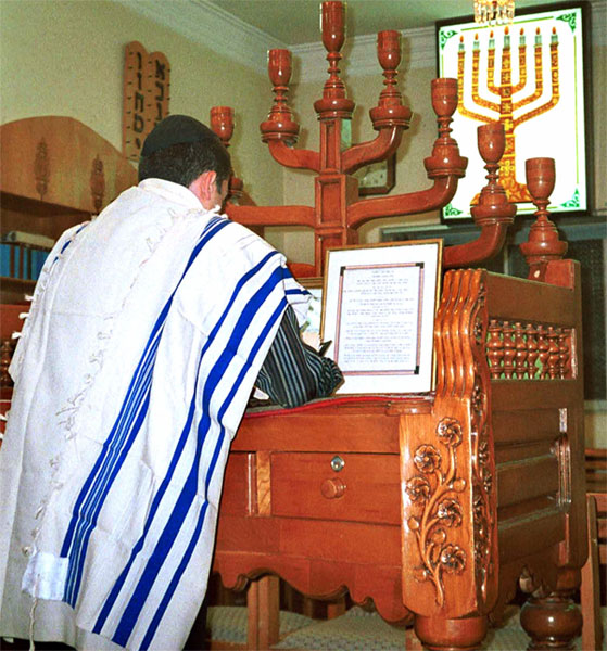 An Iranian Jew prays in a synagogue in Shiraz, Iran.