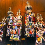 Torah scrolls adorned with keterim (crowns) and rimonim (Torah finials, literally pomegranates)