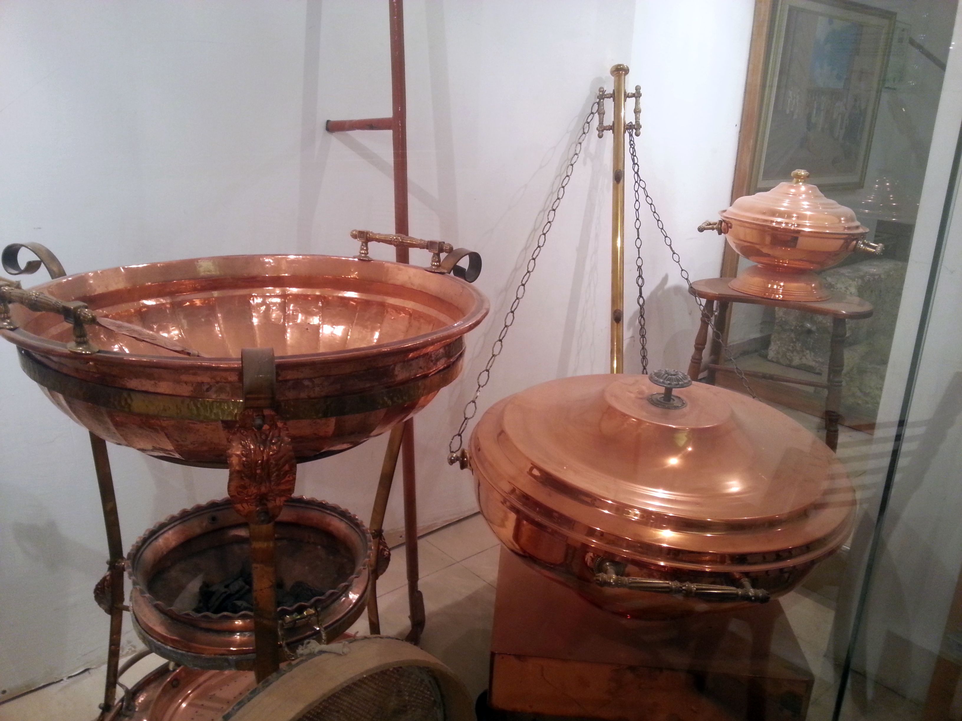 Copper vessels for the Third Temple:  On the left is the Abuv, a three- tiered stand used for roasting the Omer on Passover.  The middle tier contains coal for roasting the barley.  On the far right toward the back is the copper vessel used in preparing the meal offering.