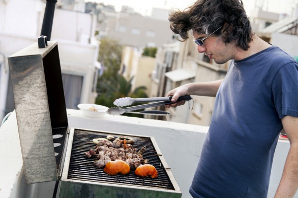 Israeli man-barbequing-rooftop