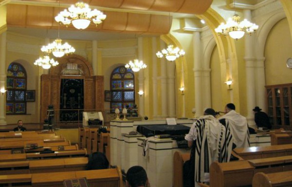 Jewish men pray in a Ukraine synagogue.