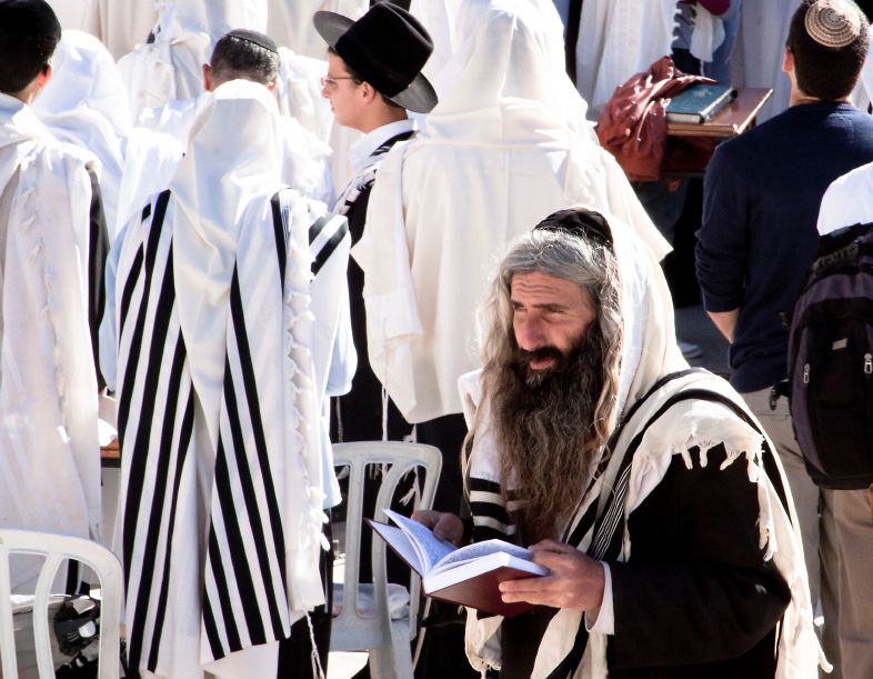 An Orthodox Jewish man prays at the Western (Wailing) Wall at Passover.