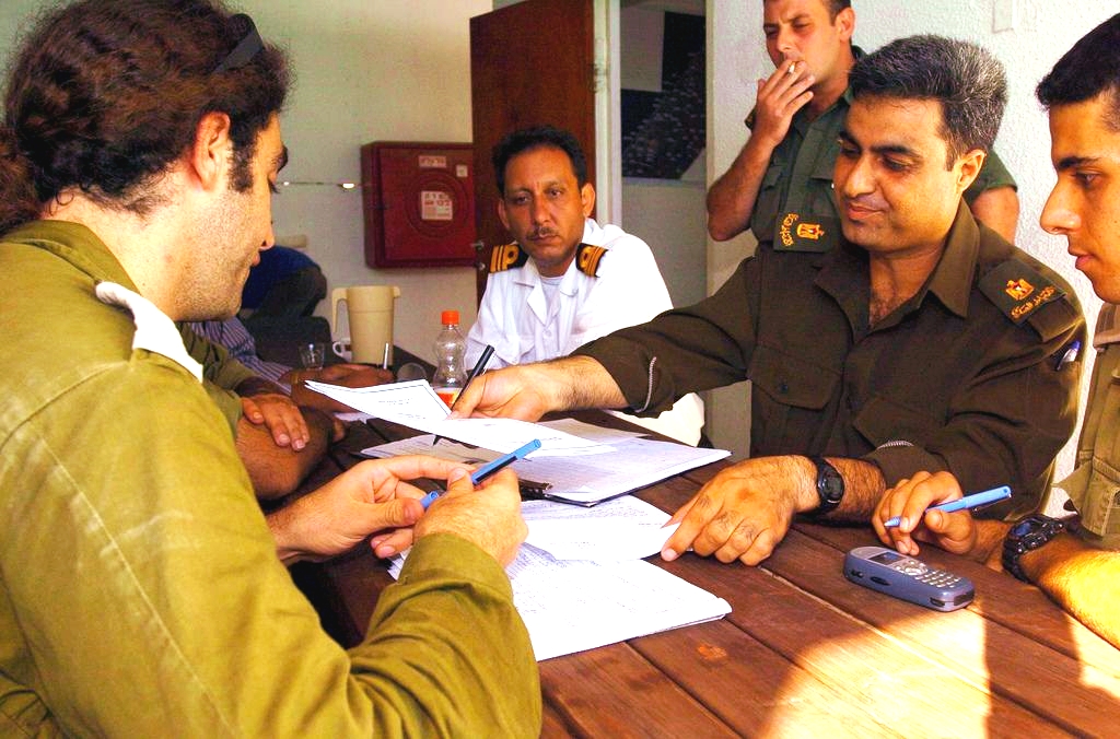 Israeli and Palestinian officers hold a field situation assessment in preparation for Israel's 2005 Gaza Disengagement.