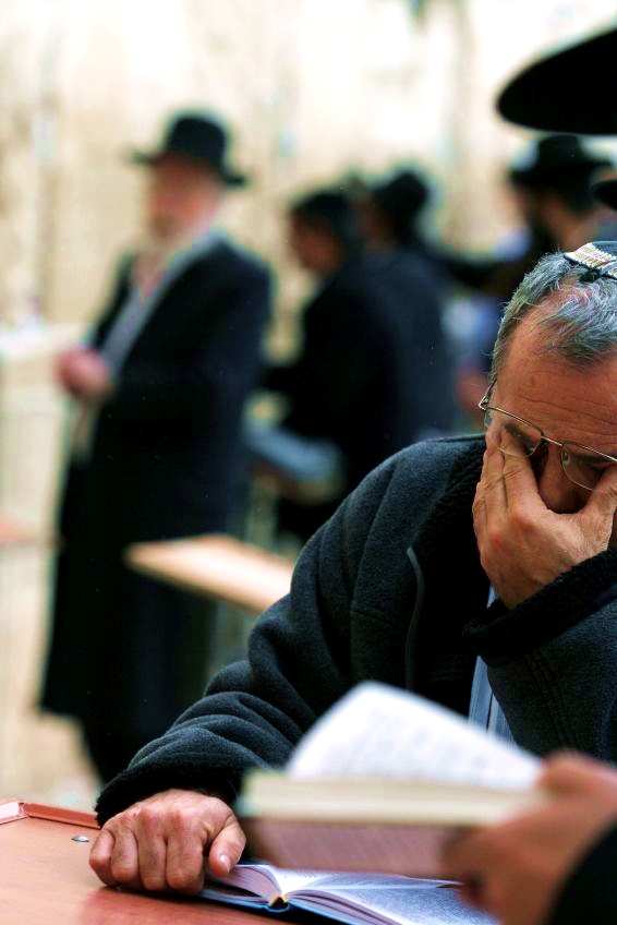 Praying selichot prayers at the Western (Wailing) Wall in Jerusalem.