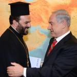 Israeli Prime Minister Benjamin Netanyahu greets Father Nadaf.