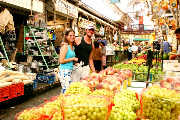 A couple shops together in the Mahane Yehuda Market in Jerusalem.