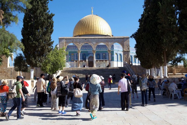 Tourists visit the Temple Mount where the First and Second Temples were located in Jerusalem.  Currently, the Dome of the Rock occupies the spot where the ancient Temple once stood. 