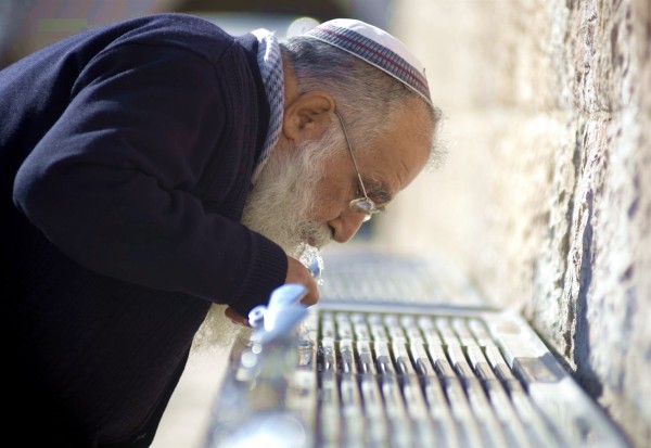 Drinking from a fountain at the Kotel