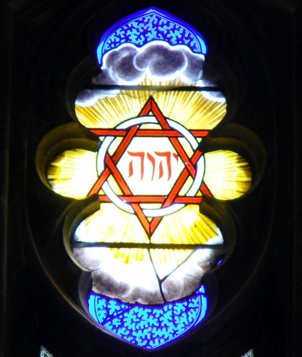 The Tetragrammaton (YHVH) in a stain-glass window in Winchester Cathedral