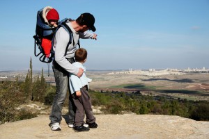 An Israeli father points out the family's hometown during a hike.