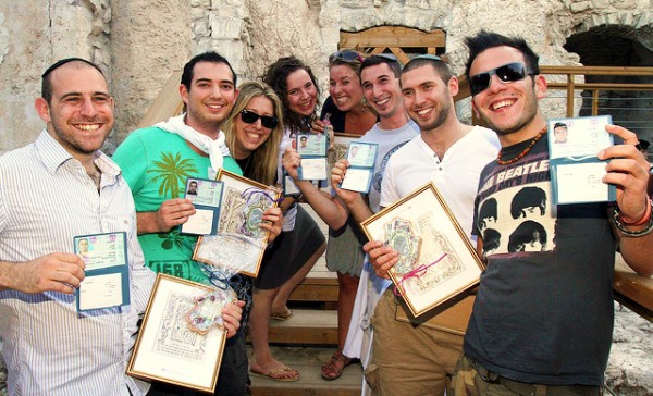 British olim (immigrants) to Israel proudly display their new citizenship papers.