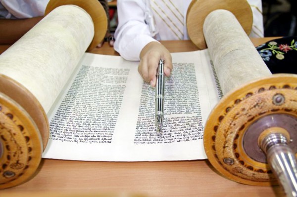 Reading from a Torah scroll 