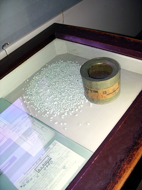 A can of Zyklon B with adsorbent granules and original signed documents detailing ordering of Zyklon B as "materials for Jewish resettlement" are on display at the Auschwitz concentration camp museum.