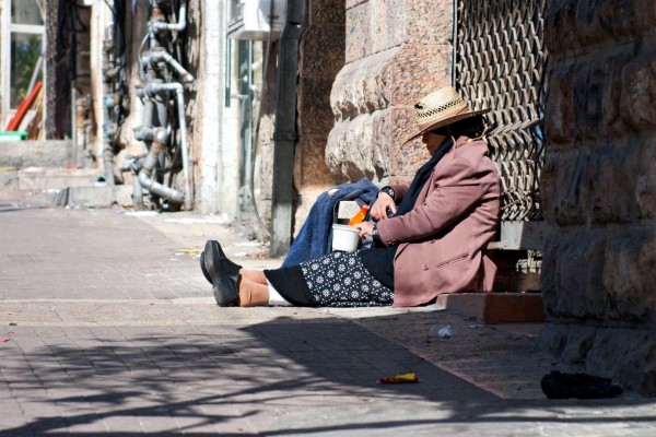 A woman begs in the Jewish Quarter of Jerusalem.