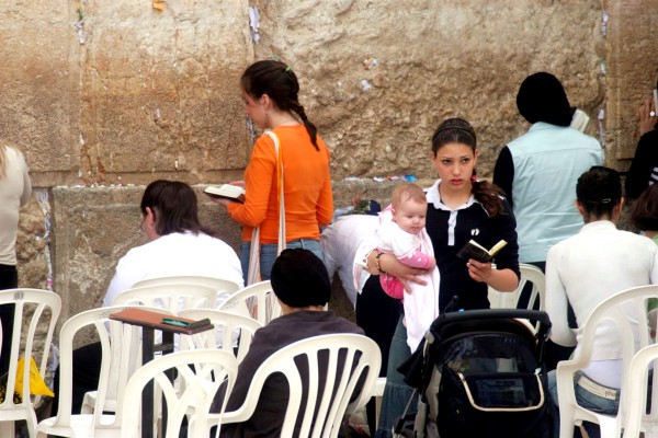 Women are not permitted to wear tallitot at the Western Wall.