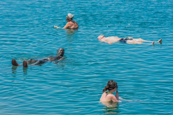 Dead Sea-tourists-swimming-floating-mud treatment