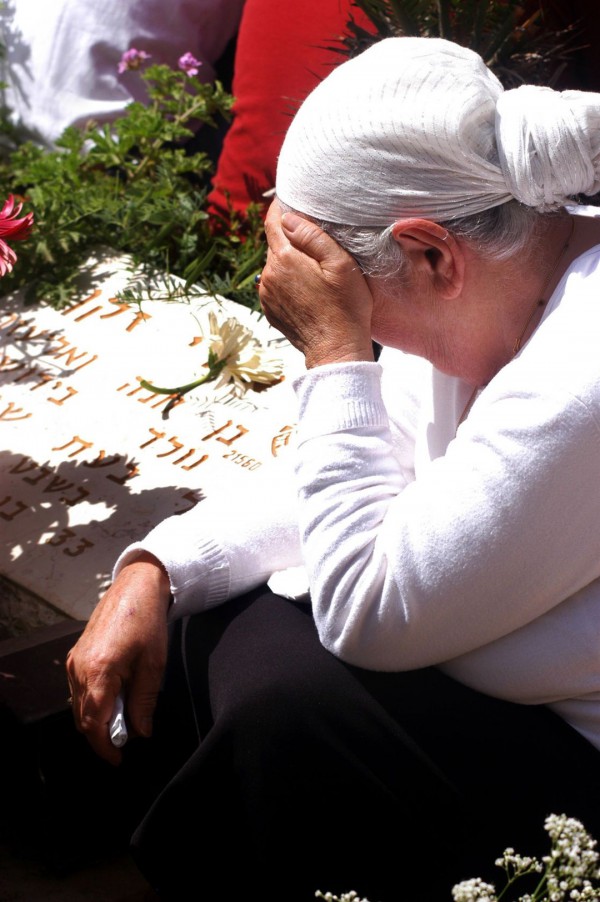 An Israeli woman grieves the loss of a loved one-Yom HaZikaron