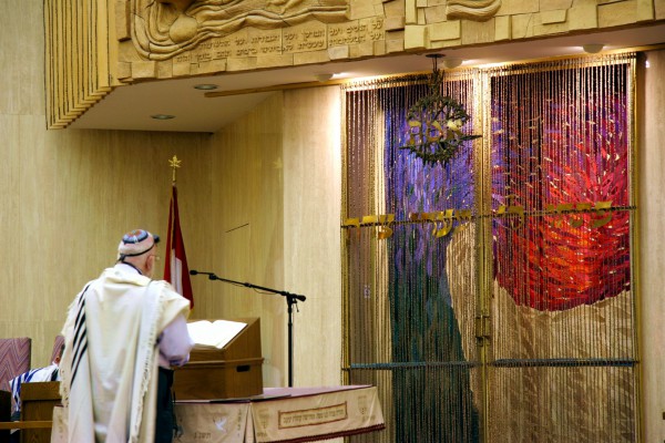 Leading the prayers from the bimah (podium) in a synagogue in Canada.