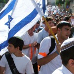 Israelis carry flags through the streets of Jerusalem.