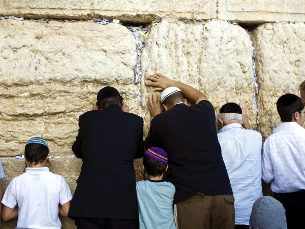 Jewish men and children pray at the Western (Wailing) Wall in Jerusalem.