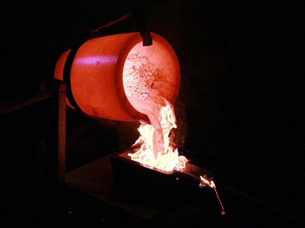 Smelted gold is poured into moulds.