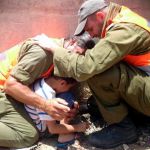 IDF officers shield a 4-year-old boy, protecting him with their own bodies during a Hamas rocket attack