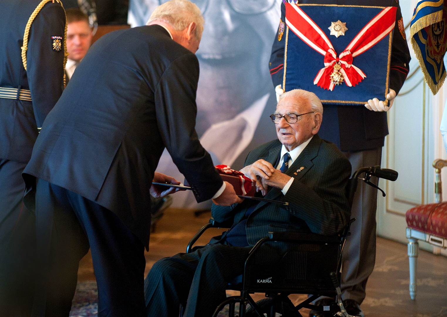 Sir Nicholas Winton (right) receives the Order of the White Lion from Czech President Miloš Zeman (left) at Prague Castle in Prague, Republic, on October 28, 2014.