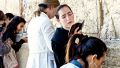 A Jewish woman sways back and forth as she prays at the Western (Wailing) Wall in Jerusalem.