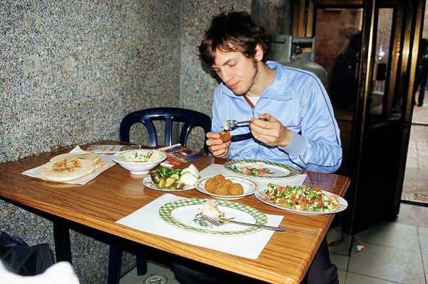 A Jewish man eats falafel in Israel.