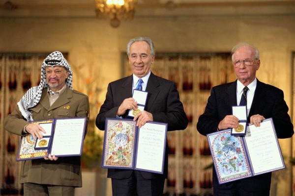 From right to left, Yitzhak Rabin, Shimon Peres and Yasser Arafat receive the Nobel Peace Prize following the Oslo Accords.