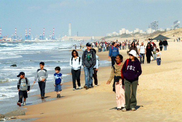 Israeli families walk together in a nature reserve near Ashdod.