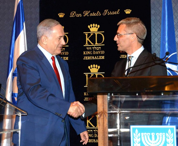 Prime Minister Benjamin Netanyahu shakes hands with Jesper Vahr, Denmark's ambassador to Israel, during a meeting with ambassadors from NATO member states.