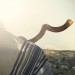 Jewish man blowing shofar over Jerusalem